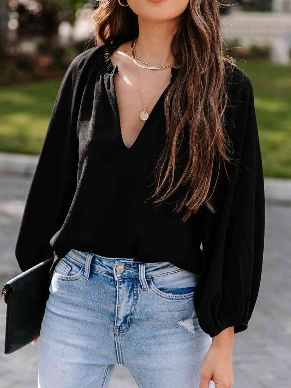 Blusa de manga larga con cuello con muescas