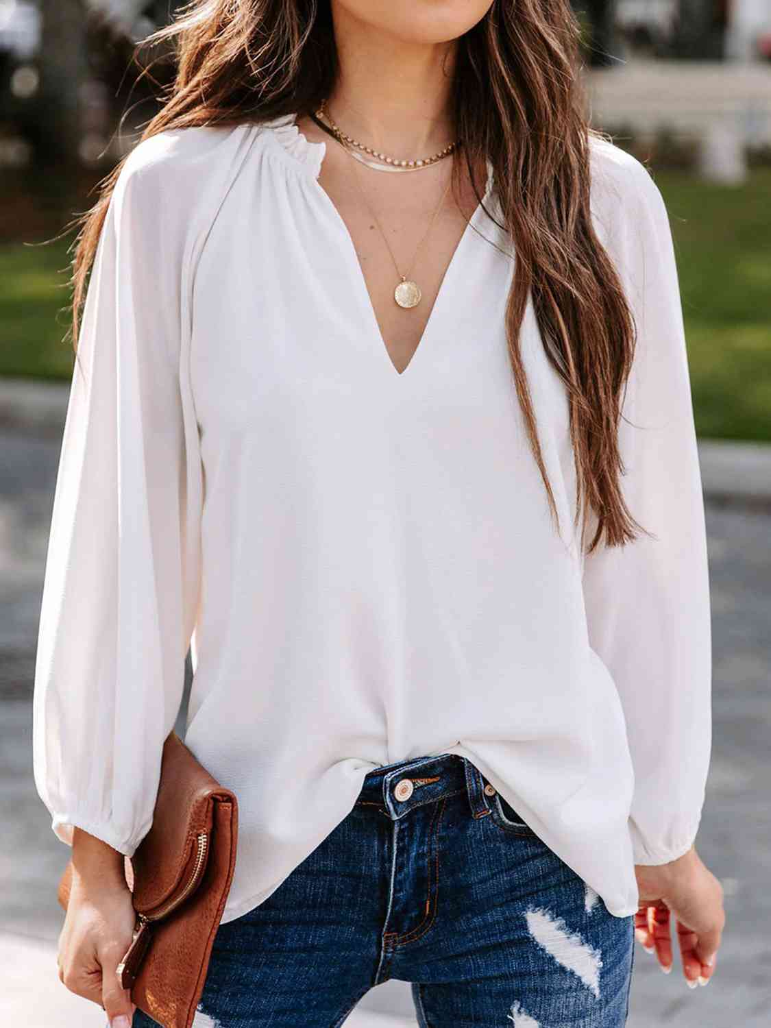 Blusa de manga larga con cuello con muescas