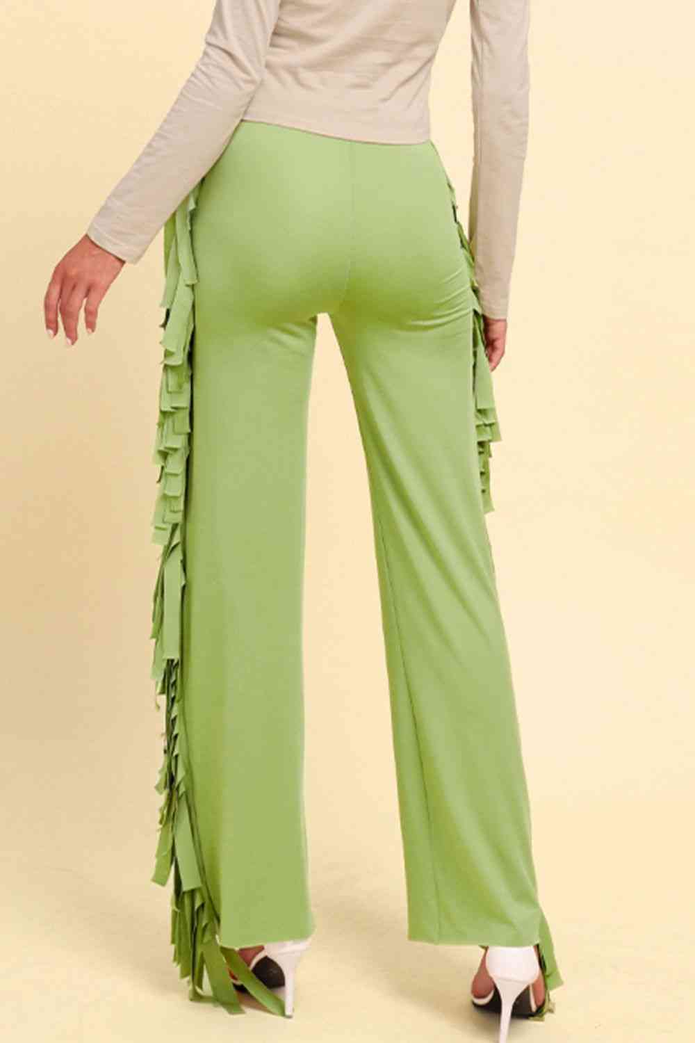 Pantalones anchos con ribete de flecos