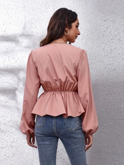 Blusa peplum con manga globo y cuello en V