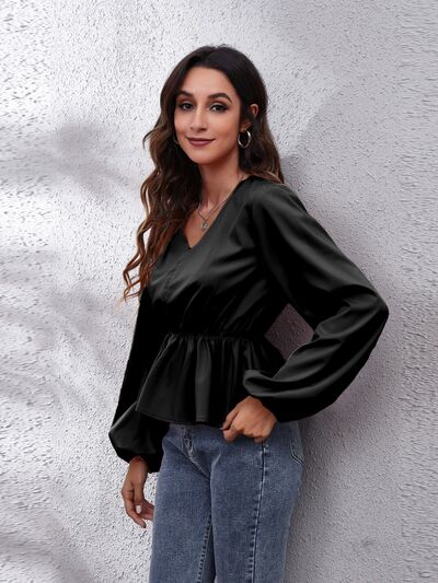 Blusa peplum con manga globo y cuello en V