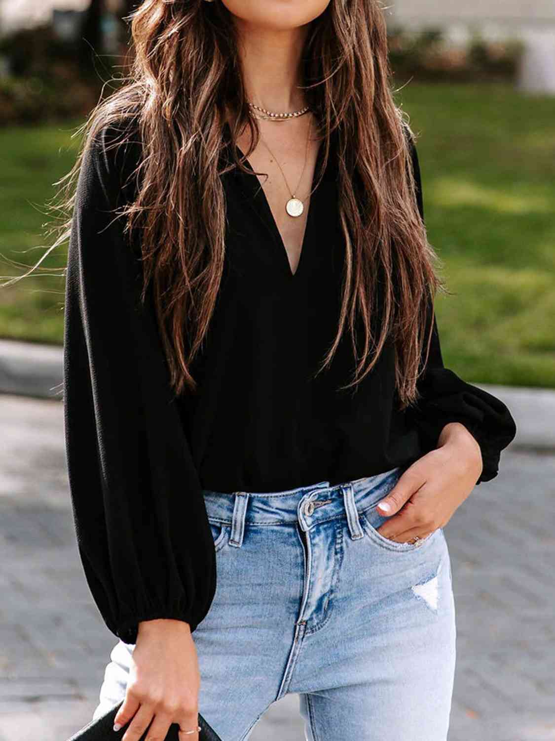 Blusa de manga larga con cuello con muescas