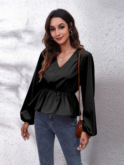 Blusa peplum con manga globo y cuello en V