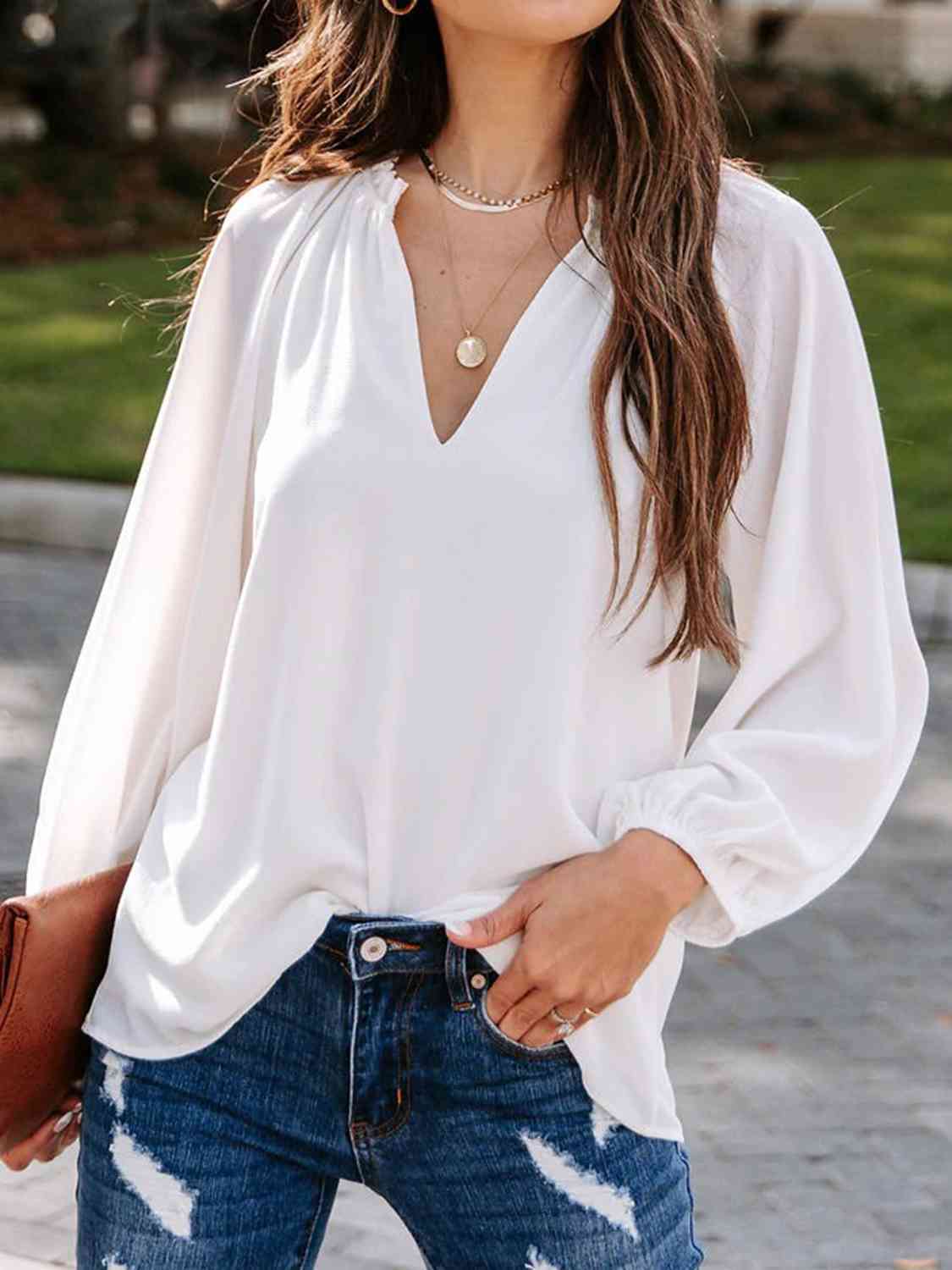 Blusa de manga larga con cuello con muescas