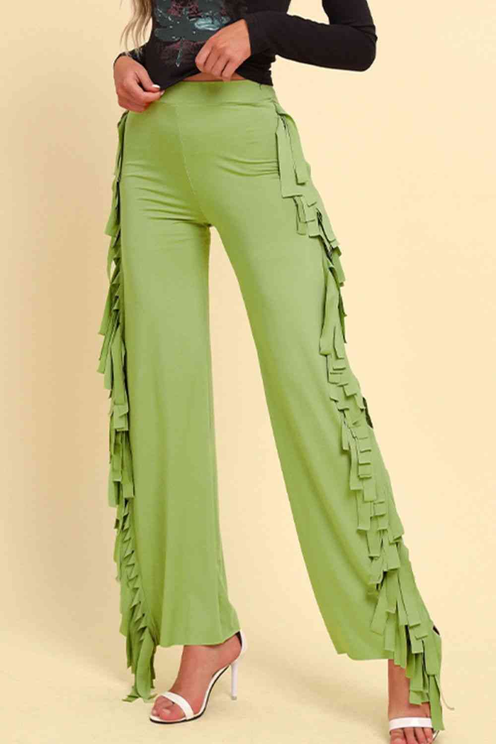 Pantalones anchos con ribete de flecos